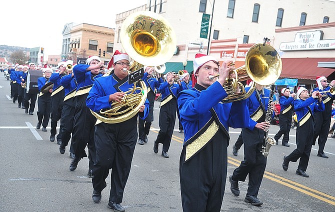 The Prescott High School marching band participates in the downtown Christmas parade Dec. 1, 2018, in Prescott. The Pride of Prescott Marching Band and String Orchestra has been invited to perform in the Pearl Harbor memorial commemoration events on Dec. 7, 2019 in Honolulu, Hawaii. (Les Stukenberg/Courier, file)