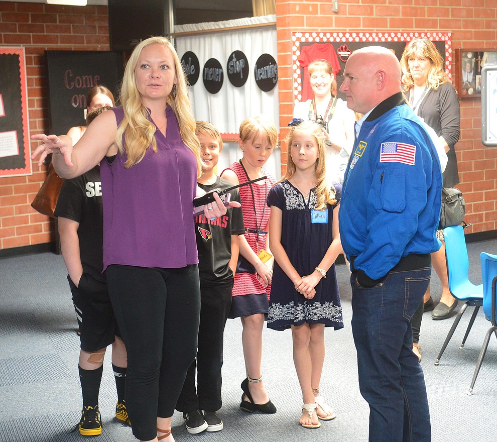 Former astronaut Mark Kelly gets a tour of the school with Principal Kelsey Seccor as he visits Taylor Hicks Elementary School in Prescott Thursday, Aug. 29, 2019. (Les Stukenberg/Courier)