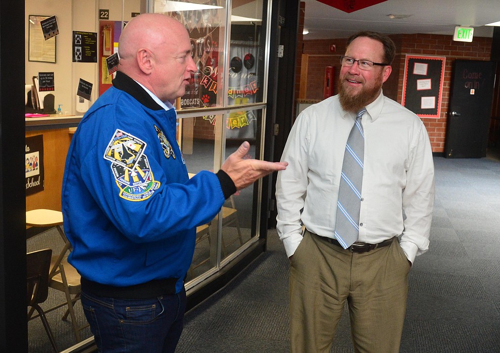 Former astronaut Mark Kelly talks with Superintendent Joe Howard as he visits Taylor Hicks Elementary School in Prescott Thursday, Aug. 29, 2019. (Les Stukenberg/Courier)