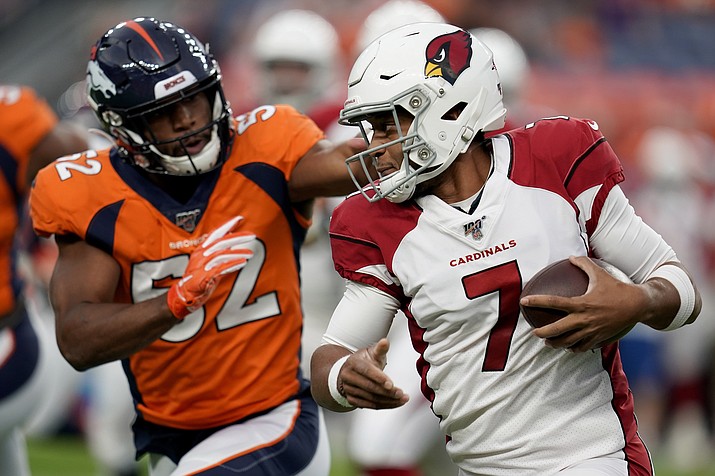 Arizona Cardinals quarterback Brett Hundley (7) tries to elude the reach of Denver Broncos linebacker Justin Hollins (52) during the first half of a preseason game, Thursday, Aug. 29, 2019, in Denver. (Jack Dempsey/AP)