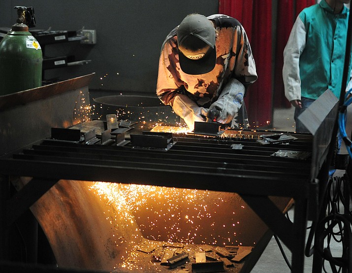 Bradshaw Mountain’s Byron Simmons uses a plasma cutter in the Auto Body Collision Repair class at the Career Technical Development District (CTED) classrooms and labs in Prescott Thursday, Aug. 29, 2019. (Les Stukenberg/Courier)