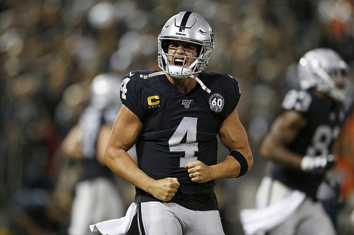 Oakland Raiders quarterback Derek Carr reacts after running back Josh Jacobs scored a touchdown during the fourth quarter of an NFL football game against the Denver Broncos Monday, Sept. 9, 2019, in Oakland, Calif. (D. Ross Cameron/AP)