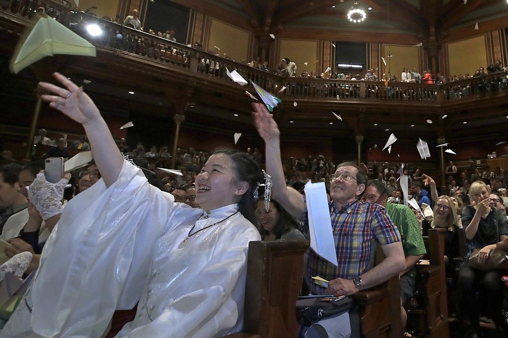 Audience members toss paper airplanes at the 29th annual Ig Nobel awards ceremony at Harvard University, Thursday, Sept. 12, 2019, in Cambridge, Mass. The spoof prizes for weird and sometimes head-scratching scientific achievement are bestowed by the Annals of Improbable Research magazine, and handed out by real Nobel laureates. (AP Photo/Elise Amendola)