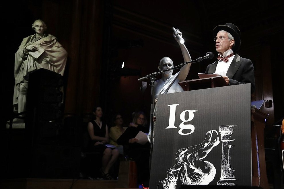 Marc Abrahams, far right, presides over the 29th annual Ig Nobel awards ceremony at Harvard University, Thursday, Sept. 12, 2019, in Cambridge, Mass. The spoof prizes for weird and sometimes head-scratching scientific achievement are bestowed by the Annals of Improbable Research magazine, and handed out by real Nobel laureates. (AP Photo/Elise Amendola)