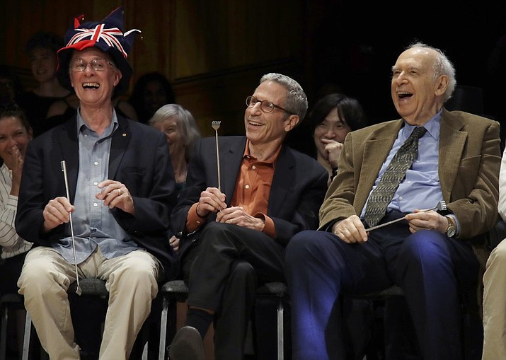 From left, Nobel Laureates Rich Roberts (Medicine, 1993), Eric Maskin (Economics, 2007), and Jerome Friedman (Physics, 1990) laugh during the 29th annual Ig Nobel awards ceremony at Harvard University, Thursday, Sept. 12, 2019, in Cambridge, Mass. The spoof prizes for weird and sometimes head-scratching scientific achievement are bestowed by the Annals of Improbable Research magazine, and handed out by real Nobel laureates. (AP Photo/Elise Amendola)