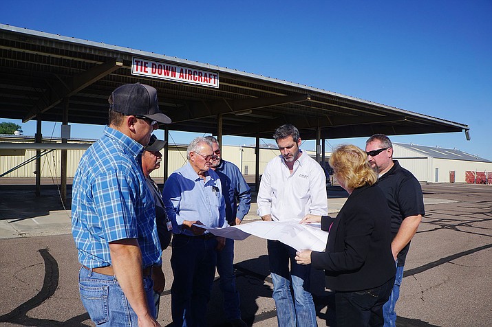 Members of the Fann Contracting team met with Airport Director Robin Sobotta in mid-August to review the plans for construction of the new airport terminal. (Cindy Barks/Courier file)