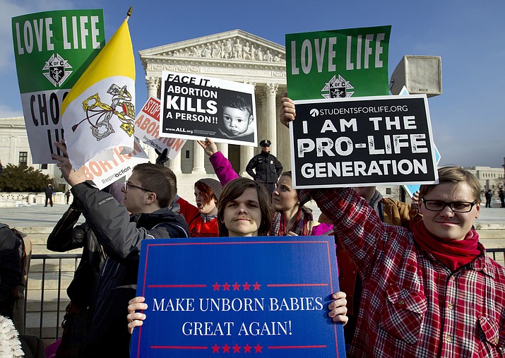 In this Jan. 18, 2019, file photo, anti-abortion activists protest outside of the U.S. Supreme Court, during the March for Life in Washington. The number and rate of abortions across the United States have plunged to their lowest levels since the procedure became legal nationwide in 1973, according to new figures released Wednesday, Sept. 18. (AP Photo/Jose Luis Magana, File)