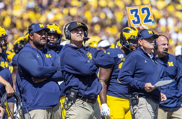 Michigan head coach Jim Harbaugh, center, reacts looking up at the scoreboard in the second quarter of a game against Army in Ann Arbor, Mich., Saturday, Sept. 7, 2019. (Tony Ding/AP)