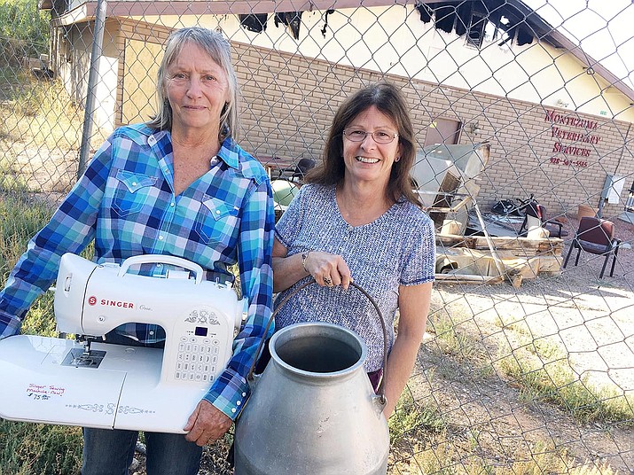 Kathy Davis and Sue Ayers, from left, collect items for a Sept. 27-28 yard sale to benefit Montezuma Veterinary Services. The business’ location on Montezuma Castle highway was destroyed by fire on July 25. VVN photo/Bill Helm