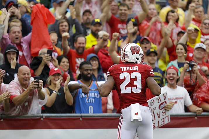 Wisconsin running back Jonathan Taylor celebrates a touchdown against Michigan during the first half of a game Saturday, Sept. 21, 2019, in Madison, Wis. (Andy Manis/AP)