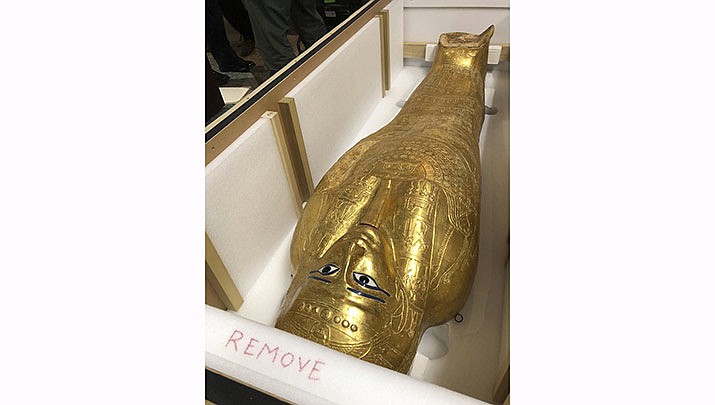 The Coffin of Nedjemankh is shown in a crate on Wednesday, Sept. 25, 2019 in New York, before it is returned to Egypt. The gilded coffin that was featured at New York's Metropolitan Museum of Art is on its way back to Egypt after it was determined to be a looted antiquity. (AP Photo/Michael R. Sisak)