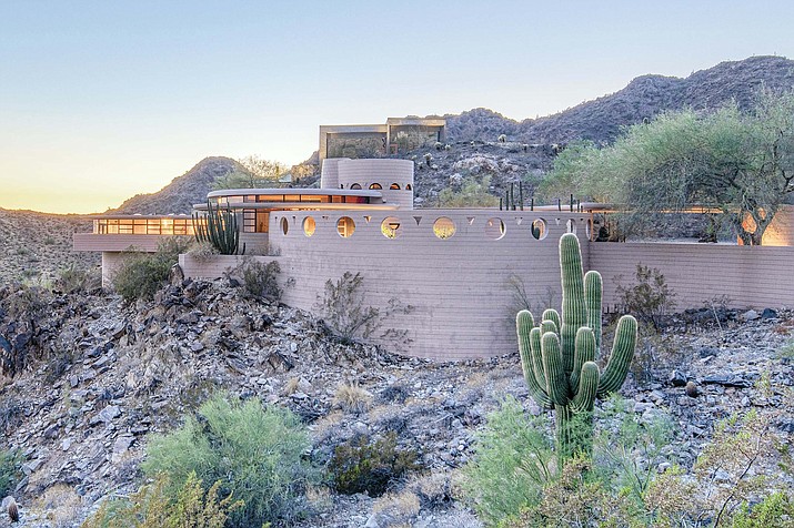 This undated photo provided by Heritage Auctions in September 2019 shows a home in Phoenix designed by architect Frank Lloyd Wright. The Norman Lykes House will be up for auction in October 2019. Wright designed the home, nicknamed the “Circular Sun House,” before his 1959 death. (Craig Root/Heritage Auctions via AP)