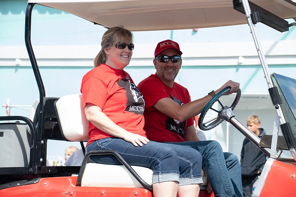 Mohave Community College President Stacy Klippenstein, and his wife Carrie lead the MCC team through the 49th annual Andy Devine Days Parade Saturday, Sept. 28, 2019. (Photo by Vanessa Espinoza/Daily Miner)