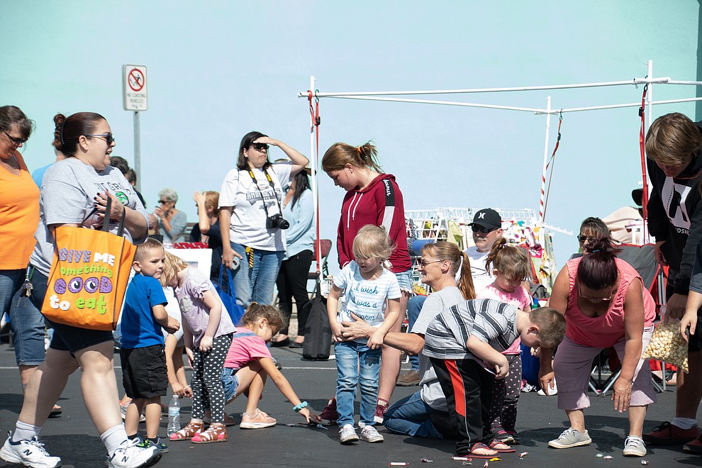 Children picking up candy at the 49th annual Andy Devine Days Parade. (Photo by Vanessa Espinoza/Daily Miner)