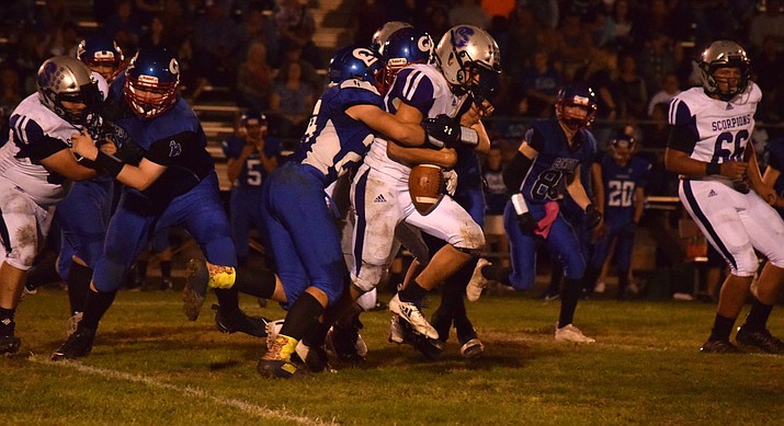Camp Verde sophomore Emmitt Smith (24) forces a fumble during the Cowboys’ 22-8 win over Sedona Red Rock on Friday night at home. VVN/James Kelley