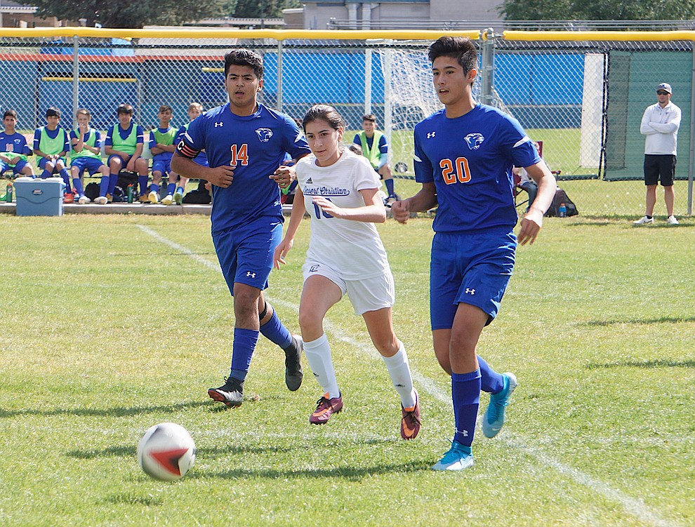 Chino Valley defender Ricardo Juarez-Flores (20) dishes off a pass during the team's 8-2 win over Desert Christian on Saturday, Sept. 28, 2019, at Chino Valley High School. (Aaron Valdez/Courier)