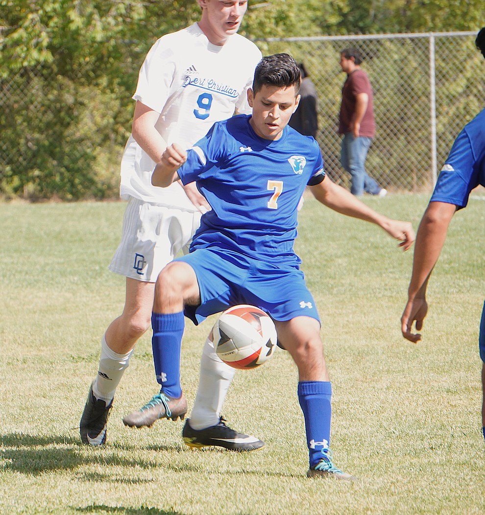 Chino Valley forward Irving Vedolla (7) half-volleys the ball to a teammate during the team's 8-2 win over Desert Christian on Saturday, Sept. 28, 2019, at Chino Valley High School. (Aaron Valdez/Courier)