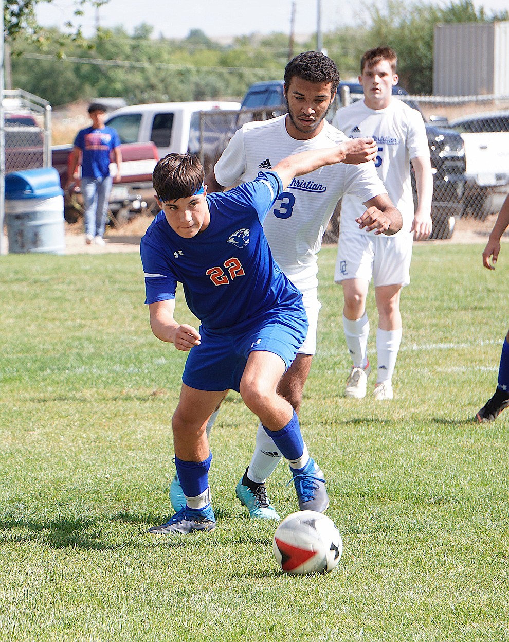 Chino Valley defender Ravi Holladay (22) gets past his defender during the team's 8-2 win over Desert Christian on Saturday, Sept. 28, 2019, at Chino Valley High School. (Aaron Valdez/Courier)