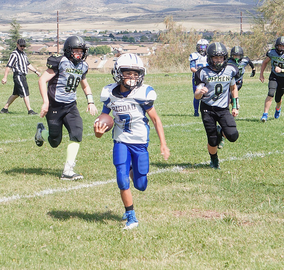 Brodie Dennis (99) and Anthony Tapia (9) of the Prescott Valley Hitmen Minors team chase down the runner during their game against Bagdad on Saturday, Sept. 28, 2019, at Bradshaw Mountain Middle School. (Aaron Valdez/Courier