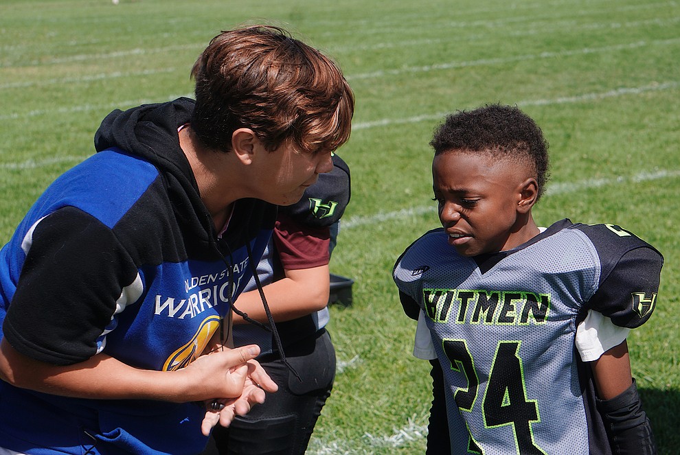 Jamir Jackson (24) of the Prescott Valley Hitmen Minors team is cheered up by a coach  during their game against Bagdad on Saturday, Sept. 28, 2019, at Bradshaw Mountain Middle School. (Aaron Valdez/Courier)