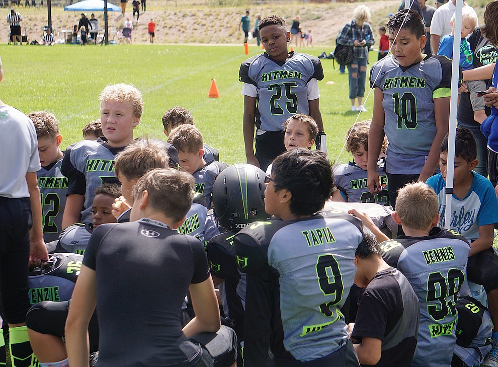 The Prescott Valley Hitmen minors team huddles up after their game against Bagdad on Saturday, Sept. 28, 2019, at Bradshaw Mountain Middle School. (Aaron Valdez/Courier)