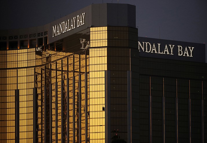 In this Oct. 3, 2017, file photo, windows are broken at the Mandalay Bay resort and casino in Las Vegas, the room from where Stephen Craig Paddock fired on a nearby music festival, killing 58 and injuring hundreds on Oct. 1. In the two years since the deadliest mass shooting in modern U.S. history, the federal government and states have taken some action to tighten gun regulations. But advocates say they're frustrated more hasn't been done since the attack in Las Vegas killed 58 people on Oct. 1, 2017, and that mass shootings keep happening across the country. (AP Photo/John Locher, File)