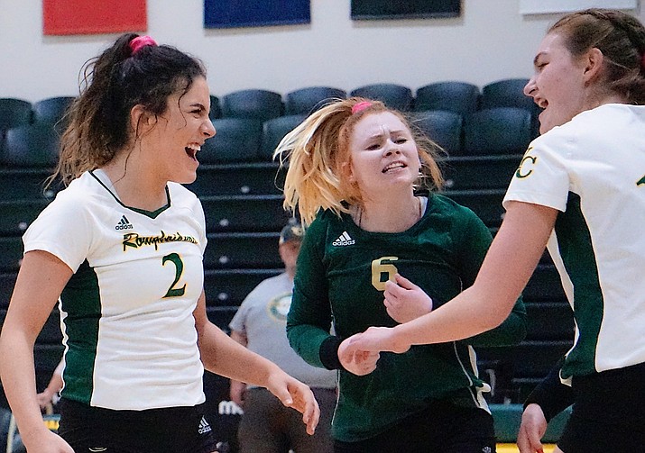 Yavapai S Pilar Daugherty (2), L Heather Wanninger (6) and MB Lacie Tenney (14) celebrate after scoring the team’s 23rd point during the fourth set in a 3-1 win over Arizona Western on Wednesday, Oct. 2, 2019, at Yavapai College. (Aaron Valdez/Couirer)