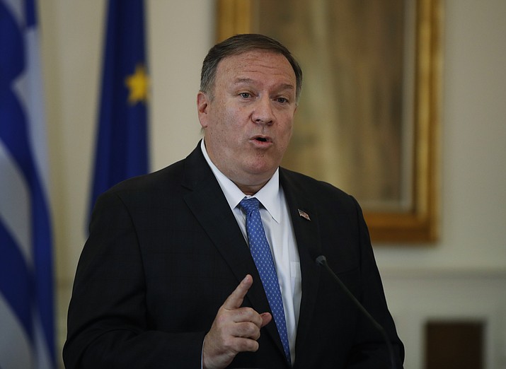 U.S. Secretary of State Mike Pompeo talks during a joint news conference with Greek Foreign Minister Nikos Dendias, following their meeting in Athens, Saturday, Oct. 5, 2019. Pompeo is in Greece on the last leg of a four-nation European tour that has been overshadowed by the impeachment inquiry in Washington. (AP Photo/Thanassis Stavrakis)