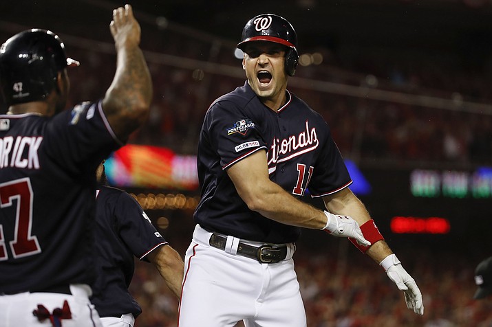 Washington Nationals first baseman Ryan Zimmerman celebrating his three-run homer off Los Angeles Dodgers relief pitcher Pedro Baez (52) with teammate Howie Kendrick in the fifth inning in Game 4 of a baseball National League Division Series, Monday, Oct. 7, 2019, in Washington.(Alex Brandon/AP)
