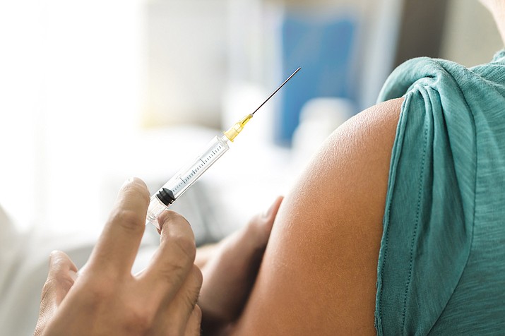 Public health officials are reminding people to receive the flu vaccination (flu shot). (Stock photo)