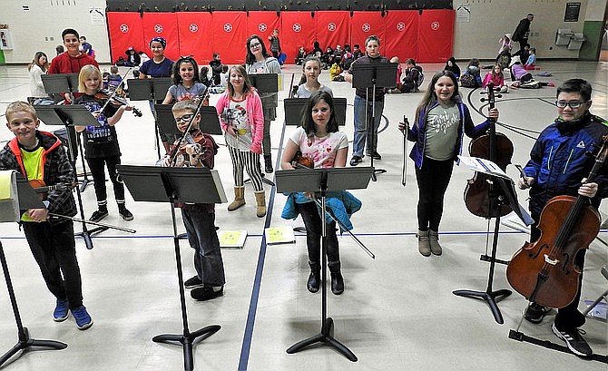Shown are Granville students with repainted music stands. Enrollment in the district’s orchestra program has grown. (HUSD/Courtesy, file)