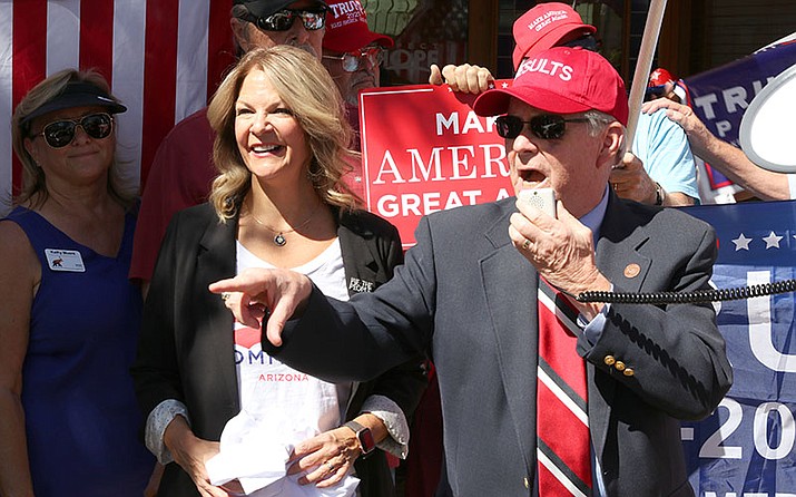 Arizona Republican Party chairwoman Kelli Ward and state Sen. Vince Leach, R-Tucson, lead the rally in front of Rep. Tom O’Halleran’s office in Casa Grande. (Annika Tomlin/Cronkite News)