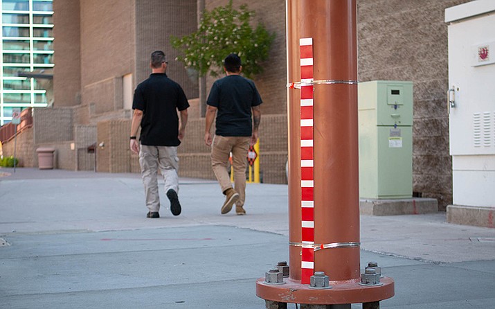 This standing-water gauge at Washington and Second streets in downtown Phoenix is part of a system called FloodAware that uses gauges and cameras to predict when a flood is coming. (Photo by Delia Johnson/Cronkite News)