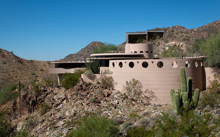 The Norman Lykes house, considered Frank Lloyd Wright’s last residential design before his death in 1959, perches on a hillside in north-central Phoenix. Once listed for $2.65 million, the house is going on the auction block without reserve on Wednesday. (Photo by Delia Johnson/Cronkite News)