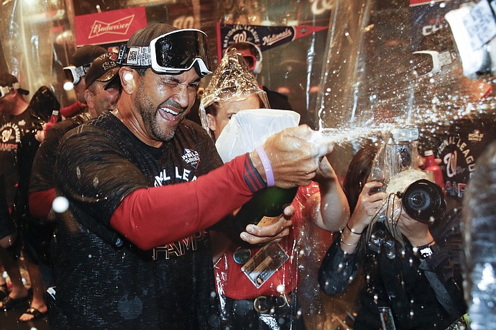 Washington Nationals manager Dave Martinez celebrates after Game 4 of the National League Championship Series against the St. Louis Cardinals Wednesday, Oct. 16, 2019, in Washington. The Nationals won 7-4 to win the series 4-0. (Patrick Semansky/AP)