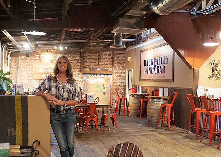 Sheri Shaw, owner of the Back Alley Wine Bar and president of the Prescott Downtown Partnership (PDP), has been a strong advocate for the revitalization of the Whiskey Row alley. The planned improved lighting and artwork is expected to make the alley a destination of its own. (Cindy Barks/Courier)