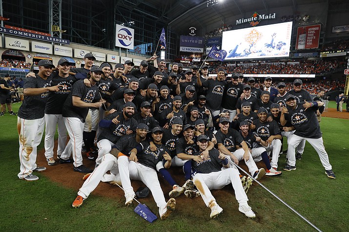 Houston Astros pose after winning Game 6 of the American League Championship Series against the New York Yankees Saturday, Oct. 19, 2019, in Houston. The Astros won 6-4 to win the series 4-2. (Matt Slocum/AP)