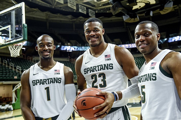 Michigan State's Joshua Langford, Xavier Tillman and Cassius Winston, from left, pose for a photo during the NCAA college basketball team's media day Tuesday, Oct. 15, 2019, in East Lansing, Mich. (Nick King/Lansing State Journal via AP)
