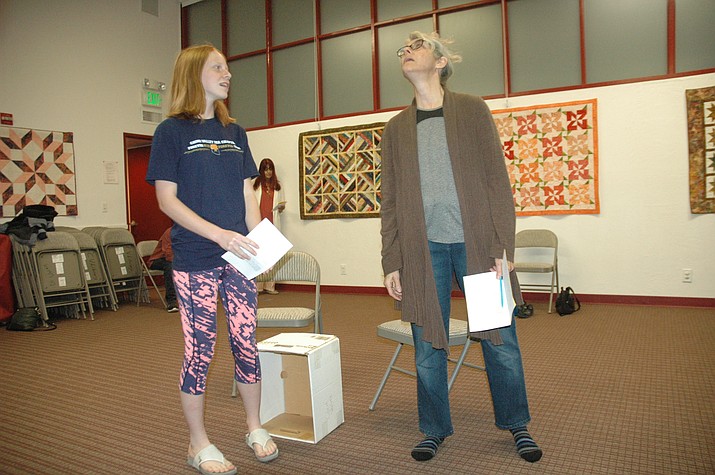 Sierra Schaible and Jami Lewis rehearse for the Chino Valley Repertory Theater’s first performance in the Chino Valley Public Library Community Room Thursday, Oct. 17. (Jason Wheeler/Review)