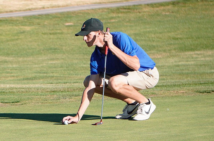 Nick Ruhrer of the Prescott golf team lines up his put during a match against Coconino and Bradshaw Mountain on Tuesday, Oct. 8, 2019, at Prescott Golf Club. (Aaron Valdez/Courier, File)