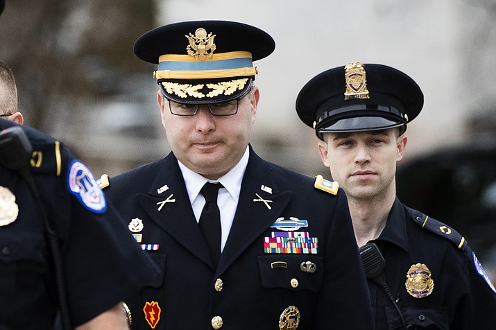 Army Lieutenant Colonel Alexander Vindman, a military officer at the National Security Council, center, arrives on Capitol Hill in Washington, Tuesday, Oct. 29, 2019, to appear before a House Committee on Foreign Affairs, Permanent Select Committee on Intelligence, and Committee on Oversight and Reform joint interview with the transcript to be part of the impeachment inquiry into President Donald Trump. (Manuel Balce Ceneta/AP)