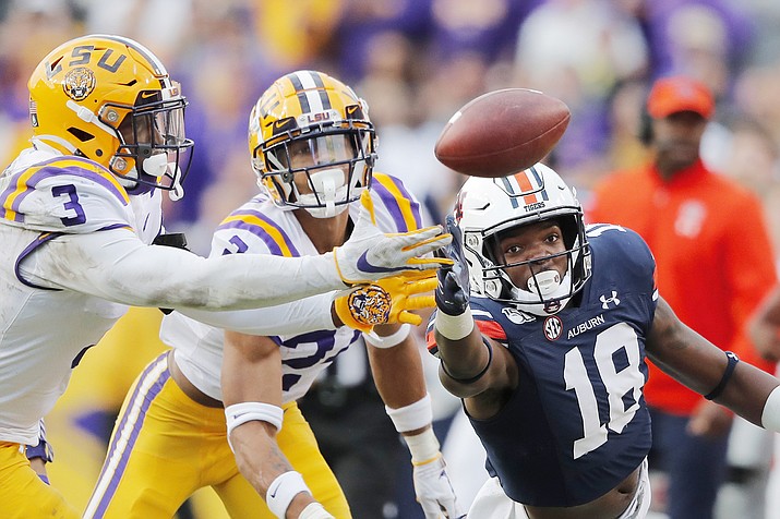 LSU cornerback Derek Stingley Jr. (24) and safety JaCoby Stevens (3) break top a pass intended for Auburn wide receiver Seth Williams (18) in the second half of an NCAA college football game in Baton Rouge, La., Saturday, Oct. 26, 2019. LSU won 23-20. (Gerald Herbert/AP)