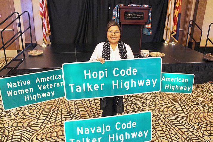Arizona Sen. Jamescita Peshlakai with highway signs honoring Native American veterans at the Arizona state-wide tribal veterans symposium Nov. 1 at Twin Arrows Navajo Casino Resort. (Submitted photo)
