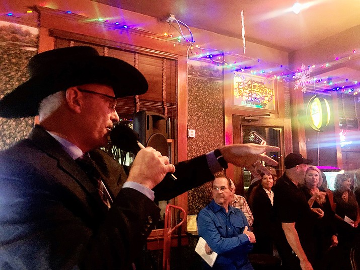 Mayor Greg Mengarelli was auctioneer Thursday, Nov. 7, 2019, at the annual Christmas Courthouse Lighting fundraising event at the Jersey Lilly Saloon on Whiskey Row. The event raised nearly $18,000. (Cindy Barks/Courier)