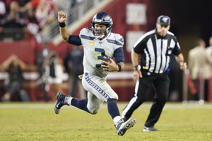 Seattle Seahawks quarterback Russell Wilson (3) runs the ball against the San Francisco 49ers during the second half of an NFL football game in Santa Clara, Calif., Monday, Nov. 11, 2019. (AP Photo/Tony Avelar)