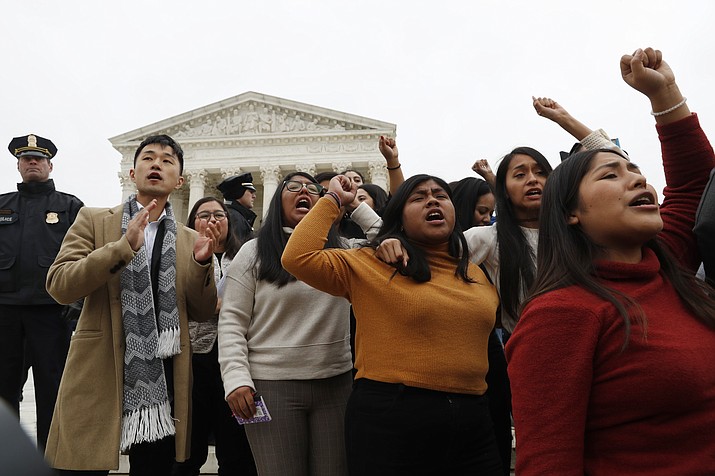 DACA recipients and others leave the Supreme Court with their hands in the air after oral arguments were heard in the case of President Trump's decision to end the Obama-era, Deferred Action for Childhood Arrivals program (DACA), Tuesday, Nov. 12, 2019, at the Supreme Court in Washington. (Jacquelyn Martin/AP)