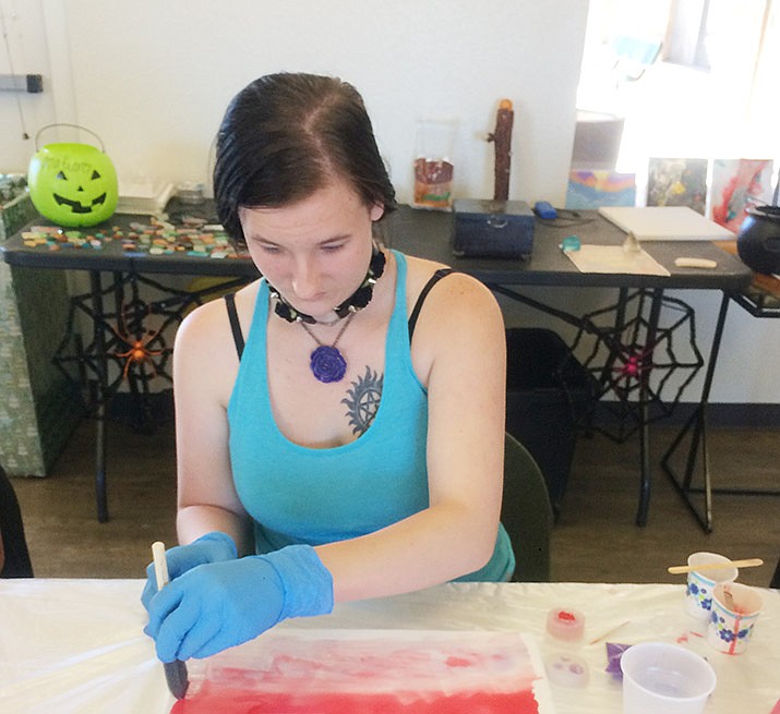 Angel Keeton participates in a resin art workshop, provided by Crooked Canes Art & More, at the Chino Valley Community Center Saturday, Oct. 26, 2019. (Jason Wheeler/Review)