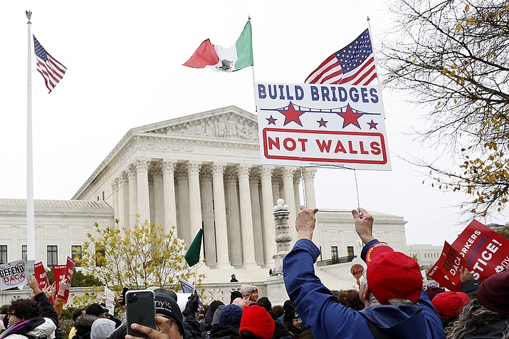 People rally outside the Supreme Court as oral arguments are heard in the case of President Trump's decision to end the Obama-era, Deferred Action for Childhood Arrivals program (DACA), Tuesday, Nov. 12, 2019, at the Supreme Court in Washington. (Jacquelyn Martin/AP)