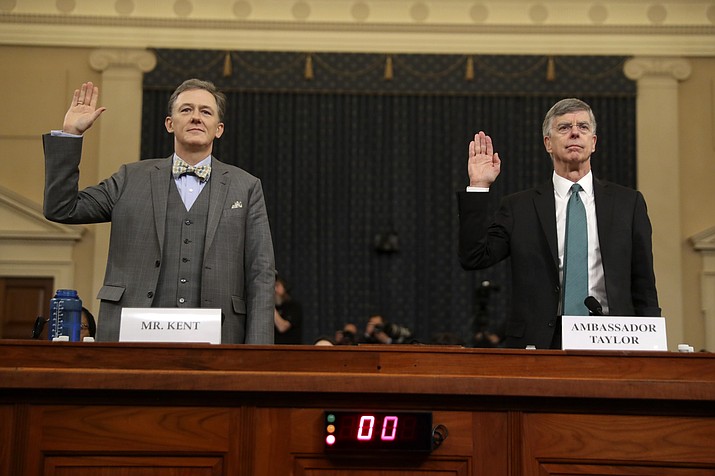 Career Foreign Service officer George Kent and top U.S. diplomat in Ukraine William Taylor, right, are sworn in to testify during the first public impeachment hearing of the House Intelligence Committee on Capitol Hill, Wednesday Nov. 13, 2019 in Washington. (Andrew Harnik/AP)