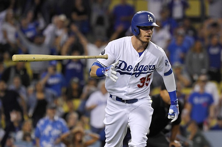 In this Sept. 18, 2019, photo, Los Angeles Dodgers’ Cody Bellinger tosses his bat as he runs to first after hitting a solo home run during the team’s game against the Tampa Bay Rays in Los Angeles. (Mark J. Terrill/AP, file)
